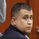George Zimmerman watches during his hearing at the Seminole County Courthouse Oct. 19, 2012, in Sanford, Fla.
Stephen M. Dowell-Pool/Getty Images